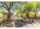 Street view of well-maintained community with lush landscaping at 10013 Sable Point St, Las Vegas, NV 89178