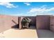 The outdoor patio has a BBQ grill and a sleek minimalist design for outdoor relaxation at 10013 Sable Point St, Las Vegas, NV 89178