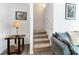 Carpeted staircase with white walls and framed art leading upstairs at 10013 Sable Point St, Las Vegas, NV 89178