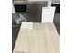 Home material selections shown: paint, vinyl plank flooring, quartz countertop, and kitchen faucet at 10275 Water Knot Ave, Las Vegas, NV 89166