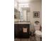 Bathroom with a modern vanity, toilet, and decorative accents, creating a stylish and functional space at 12237 Plum Mist Ct # 4, Las Vegas, NV 89183