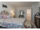 Comfortable bedroom with decorative pillows, side table, and wall decor at 12237 Plum Mist Ct # 4, Las Vegas, NV 89183
