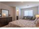 Comfortable bedroom featuring a sofa, a plush bed, and a relaxing interior at 12237 Plum Mist Ct # 4, Las Vegas, NV 89183