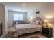 Charming bedroom featuring a bed, sitting area, and decorative touches, creating a cozy and inviting retreat at 12237 Plum Mist Ct # 4, Las Vegas, NV 89183
