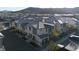 Overhead view of modern townhomes with neutral stucco exteriors and tile roofs in a residential neighborhood at 12237 Plum Mist Ct # 4, Las Vegas, NV 89183