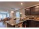 The well-equipped kitchen features granite counters, stainless steel appliances, and access to the backyard patio at 12237 Plum Mist Ct # 4, Las Vegas, NV 89183