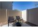 Outdoor patio featuring two chairs and a small table, perfect for enjoying a relaxing outdoor space at 12237 Plum Mist Ct # 4, Las Vegas, NV 89183