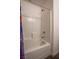 Shower and tub area with white tile and modern fixtures, providing a clean and functional space at 12237 Plum Mist Ct # 4, Las Vegas, NV 89183