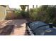 Backyard brick patio area with block wall and landscaping provides a private outdoor space at 1504 Andrew David Ave, North Las Vegas, NV 89086