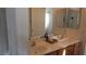 Bathroom featuring dual sinks, mirrors and a neutral color palette at 1504 Andrew David Ave, North Las Vegas, NV 89086