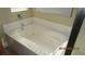 Close-up of a clean and spacious bathtub with hydrotherapy jets and chrome fixtures, offering relaxation and comfort at 1504 Andrew David Ave, North Las Vegas, NV 89086