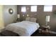 Cozy bedroom with decorative mirrors and lamps, soft lighting, and a comfortable bed at 1504 Andrew David Ave, North Las Vegas, NV 89086