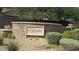 Stone wall with 'The Ranches' community sign, decorative planters, and manicured landscaping at 1504 Andrew David Ave, North Las Vegas, NV 89086