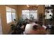 Bright dining room with a wooden table, modern chairs, and lots of natural light at 1504 Andrew David Ave, North Las Vegas, NV 89086