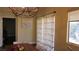 Cozy dining area featuring a wooden table, chairs, and decorative macrame at 1504 Andrew David Ave, North Las Vegas, NV 89086