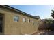 Neutral home exterior with desert landscaping and backyard at 1504 Andrew David Ave, North Las Vegas, NV 89086
