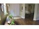 Inviting foyer featuring double doors, wood floors, and a glimpse into the adjacent living area at 1504 Andrew David Ave, North Las Vegas, NV 89086