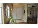 Bright foyer showcases double doors, tile, wood-look floors, and a view into the living room at 1504 Andrew David Ave, North Las Vegas, NV 89086