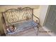 Inviting front porch with decorative iron bench and desert decor at 1504 Andrew David Ave, North Las Vegas, NV 89086