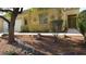 Charming home with desert landscaping, including rocks and cacti, offering a unique curb appeal at 1504 Andrew David Ave, North Las Vegas, NV 89086