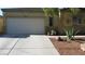 Charming single story home featuring xeriscaping, desert landscaping, and a two-car garage at 1504 Andrew David Ave, North Las Vegas, NV 89086