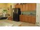 Kitchen featuring stainless steel appliances, granite counters, and wooden cabinets at 1504 Andrew David Ave, North Las Vegas, NV 89086