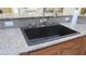 Close up of a granite kitchen sink with new faucet, offering a blend of style and functionality at 1504 Andrew David Ave, North Las Vegas, NV 89086