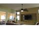 Open living space with natural light, a TV, and an open floor plan perfect for entertaining at 1504 Andrew David Ave, North Las Vegas, NV 89086