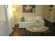 Bright living room with a decorative lamp, stylish sofa, and a decorative accent table at 1504 Andrew David Ave, North Las Vegas, NV 89086