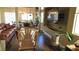 Spacious living room with ample natural light, a large TV, and an open concept design at 1504 Andrew David Ave, North Las Vegas, NV 89086