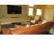 Spacious living room with wood floors, modern lighting and comfortable seating at 1504 Andrew David Ave, North Las Vegas, NV 89086
