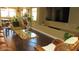 Bright living area with hardwood floors, large TV, and comfortable seating at 1504 Andrew David Ave, North Las Vegas, NV 89086