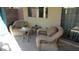 Inviting patio area with comfortable wicker chairs, perfect for relaxation at 1504 Andrew David Ave, North Las Vegas, NV 89086