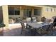 Covered patio with outdoor seating, ideal for entertaining and enjoying the backyard at 1504 Andrew David Ave, North Las Vegas, NV 89086