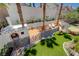 Aerial view of custom built play area featuring turf, rock climbing wall, slide and seating area at 189 Andada Dr, Henderson, NV 89012