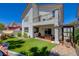 Well maintained backyard features artificial turf, a small balcony and a covered patio at 189 Andada Dr, Henderson, NV 89012