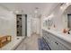 Modern bathroom boasts a glass-enclosed shower, double sinks, and contemporary fixtures at 189 Andada Dr, Henderson, NV 89012