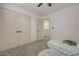 Bedroom with neutral walls, carpet flooring, and closet with paneled doors at 189 Andada Dr, Henderson, NV 89012