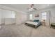 Large bedroom with plush carpet, ensuite access, and neutral decor at 189 Andada Dr, Henderson, NV 89012