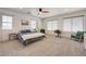 Spacious bedroom with neutral carpeting, modern furnishings, and natural light at 189 Andada Dr, Henderson, NV 89012