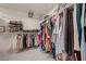 Walk-in closet with shelving, hanging racks, and ample storage for clothes and shoes at 189 Andada Dr, Henderson, NV 89012