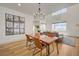 An open-concept living room and dining room with high ceilings, hardwood floors, and lots of light at 189 Andada Dr, Henderson, NV 89012