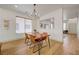 Dining area with modern chandelier, wood-style flooring and lots of natural light at 189 Andada Dr, Henderson, NV 89012