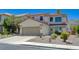 Charming two-story home features a two car garage, desert landscaping, and tile roof at 189 Andada Dr, Henderson, NV 89012