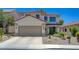 Charming two-story home features a two car garage, desert landscaping, and tile roof at 189 Andada Dr, Henderson, NV 89012