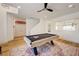 Bright game room with modern ceiling fan, a pool table, and wood-style flooring at 189 Andada Dr, Henderson, NV 89012