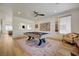 Bright game room with modern ceiling fan, a pool table, and wood-style flooring at 189 Andada Dr, Henderson, NV 89012