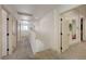 Bright hallway featuring neutral walls, carpet flooring, and white doors and trim at 189 Andada Dr, Henderson, NV 89012