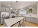 Beautiful kitchen with gray cabinetry, stainless steel appliances, and marble countertop island at 189 Andada Dr, Henderson, NV 89012
