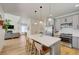 Modern kitchen featuring a island with seating, stainless steel appliances, and an open layout at 189 Andada Dr, Henderson, NV 89012